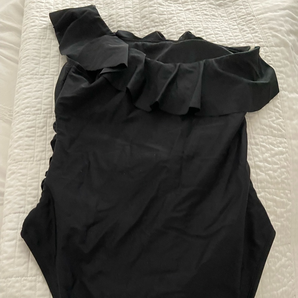 Women's One Shoulder Swimwear Asymmetric with Ruffle accent.